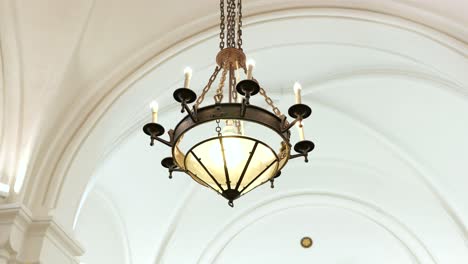 Parallax-around-vintage-chandelier-hanging-in-Lutheran-church