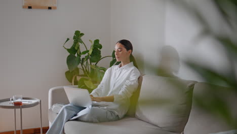 relaxed copywriter typing computer working house. student woman texting online