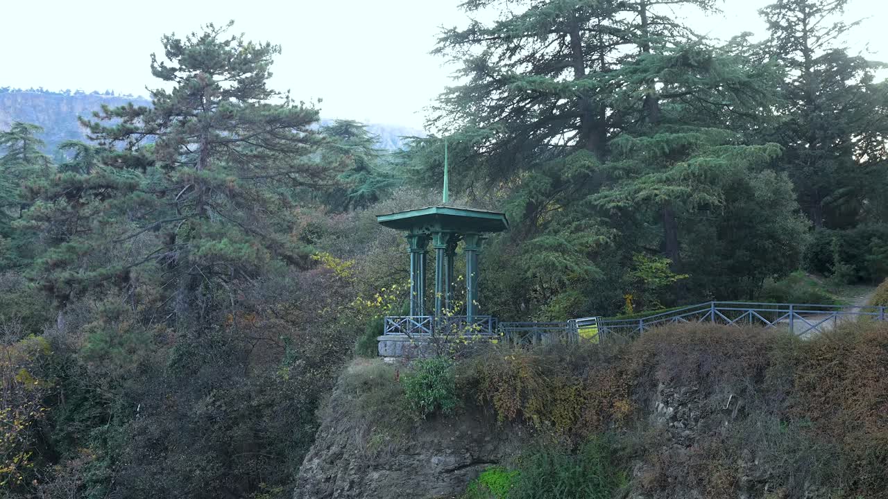 A scenic viewpoint overlooking the waterfall inside the National Botanical Gardens of Tbilisi