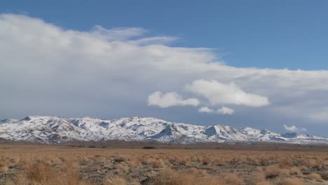 time lapse over snowclad hills in the nevada desert