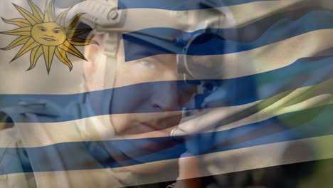 animación de la bandera de uruguay sobre un soldado caucásico con un arma