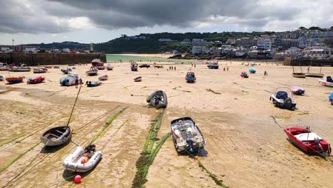 slow motion of st ives beach in cornwall with boats and people in the distance