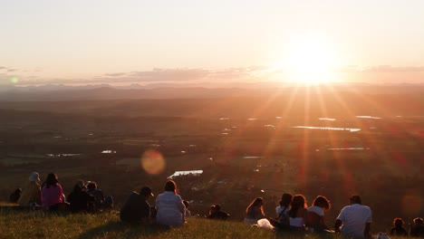 people gathered to watch a beautiful sunset