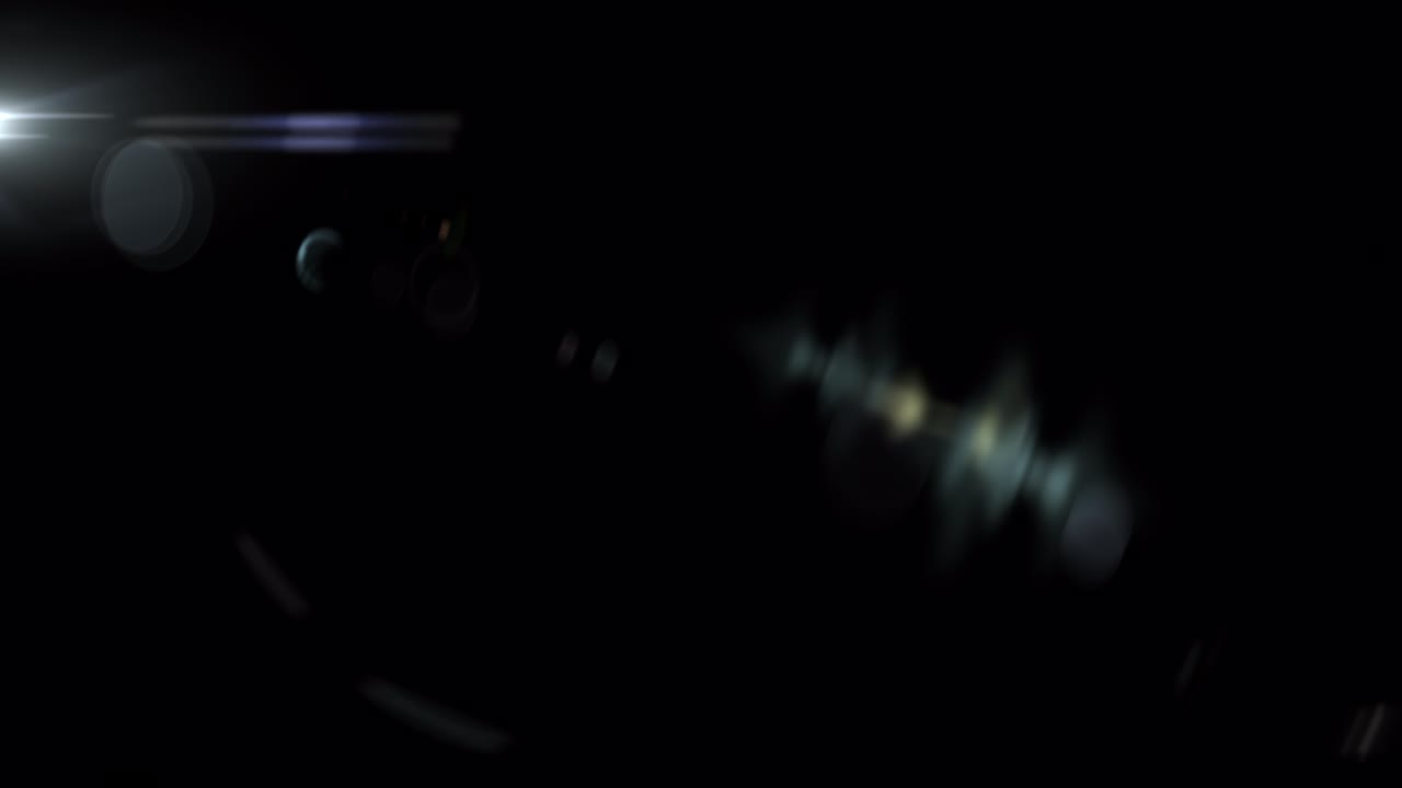 Abstract flicker  optical lens flares light rotation animation on top left black background. 4K seamless loop dynamic kinetic bright star light rays effect. Star light streaks.