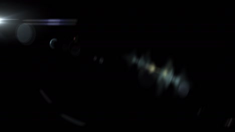 abstract flicker  optical lens flares light rotation animation on top left black background. 4k seamless loop dynamic kinetic bright star light rays effect. star light streaks.
