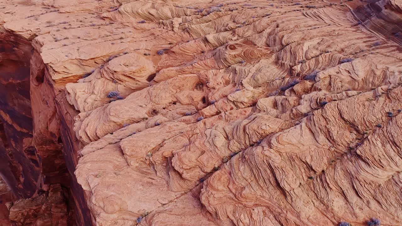 Intricate rock layers of Horseshoe Bend glow in warm sunrise hues in Arizona USA
