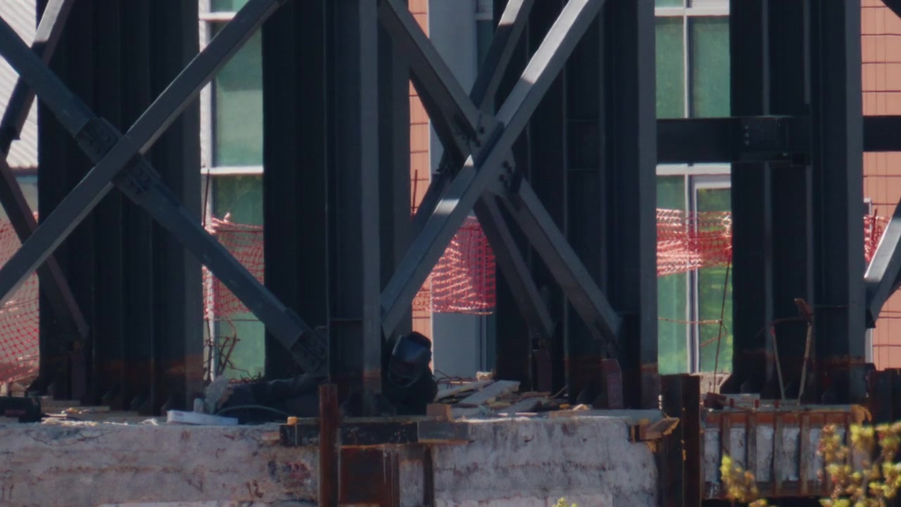 Close up view of steel beams and structural supports on an active construction site