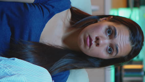 vertical video: lady reacting to impressive moment on tv