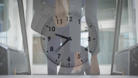 clock animation over people walking in office building