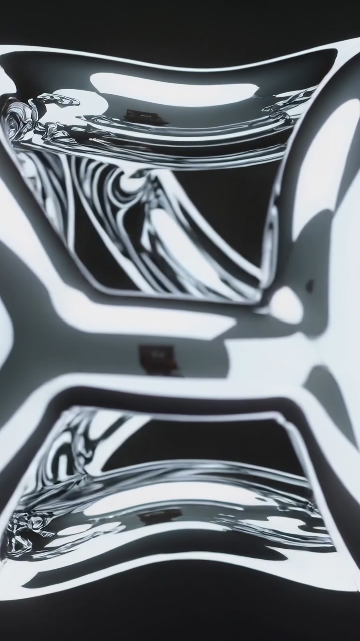 Vertical video: Cam panning zooming starting metal tubes rotating and revealing dark core in design