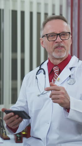 doctor consulting with patient using smartphone