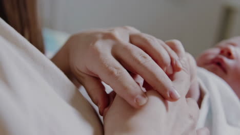 close-up of gentle hands holding, symbolizing care and connection