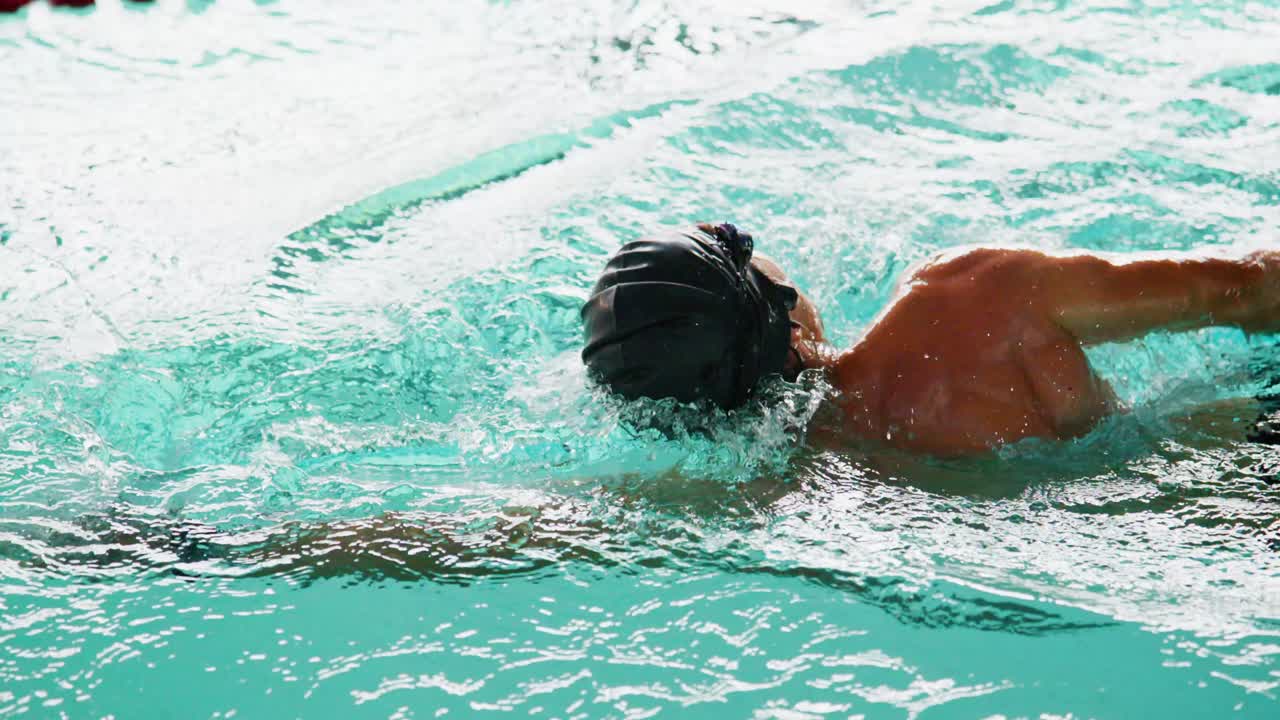 A Dedicated Swimmer Practicing Technique in a Pool, Showcasing Elegance and Fluidity of Movements While Engaging in a Competitive Swim Routine