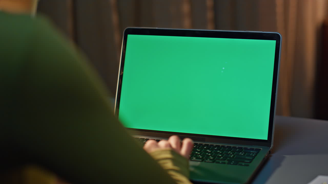 Student surfing green screen laptop internet night home close up. Woman working
