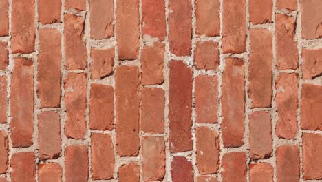 seamless looping motion. specially prepared for filling the background with a seamless brickwork pattern. antique brickwork of baked clay brick. vertically oriented video.