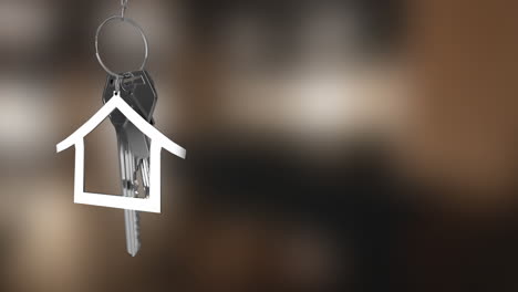 animation of hanging silver house keys against blurred background with copy space