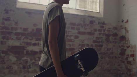 fashionable young man in an abandoned warehouse