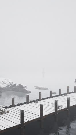 snowy winter dock in fog