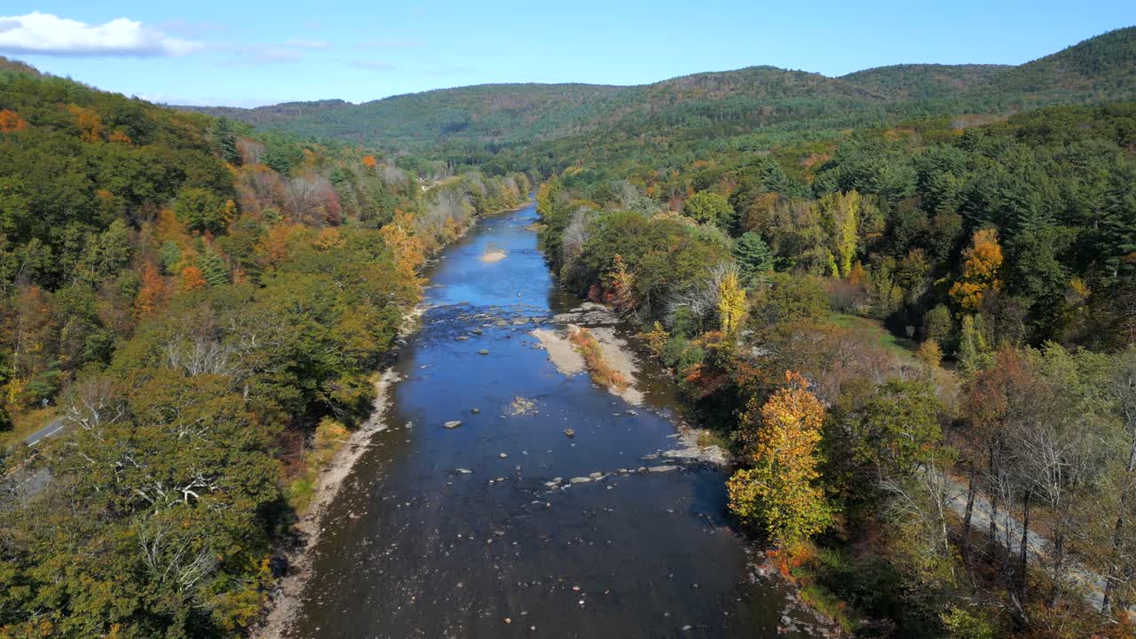 Aerial dolly upstream of forested riverbanks West River, Green Mountains Vermont USA