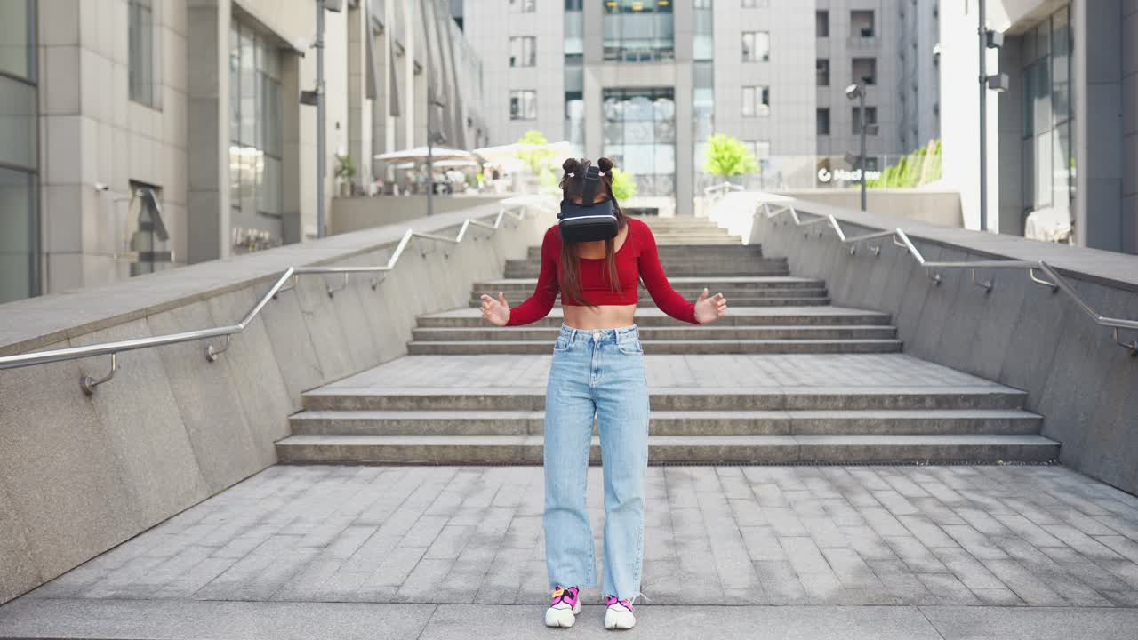 Woman wearing VR headset on stairs in city