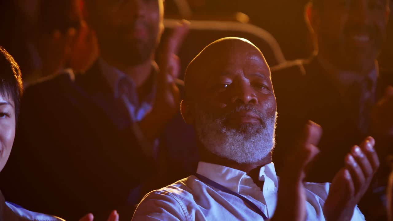 African American businessman applauding in business seminar at auditorium 4k
