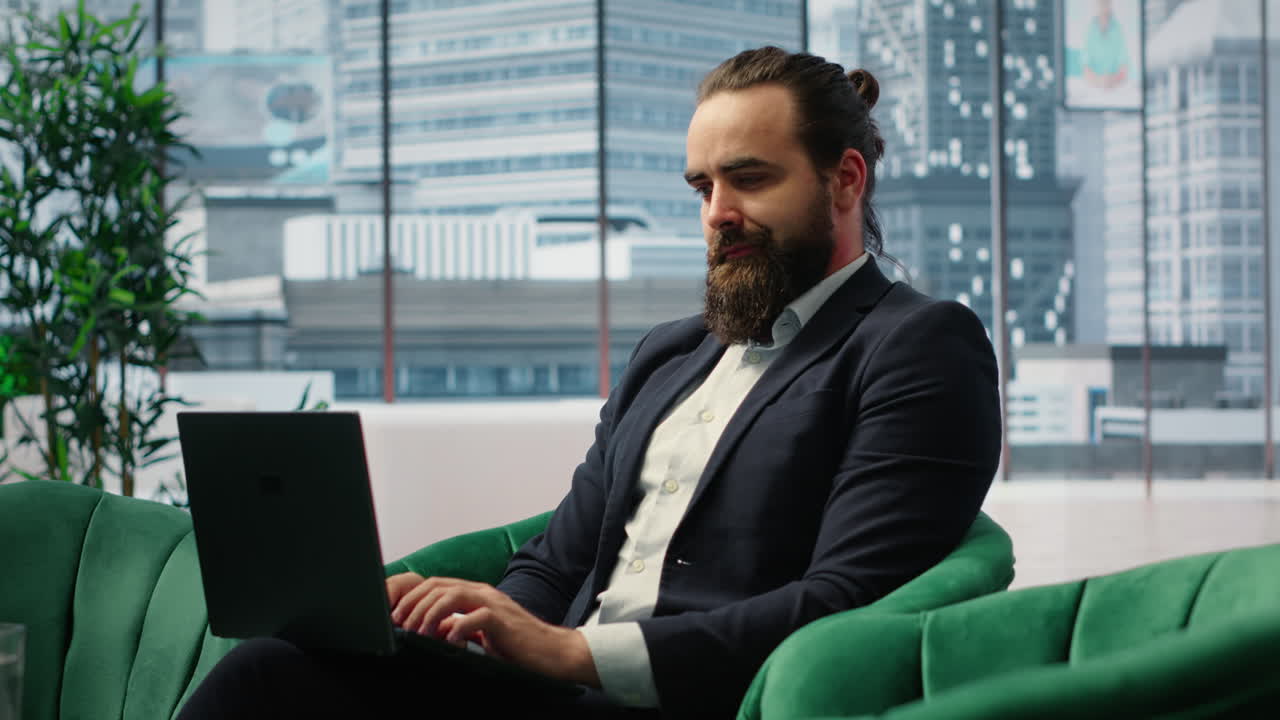 Vertical Video Confident businessman manages corporate expenses on laptop