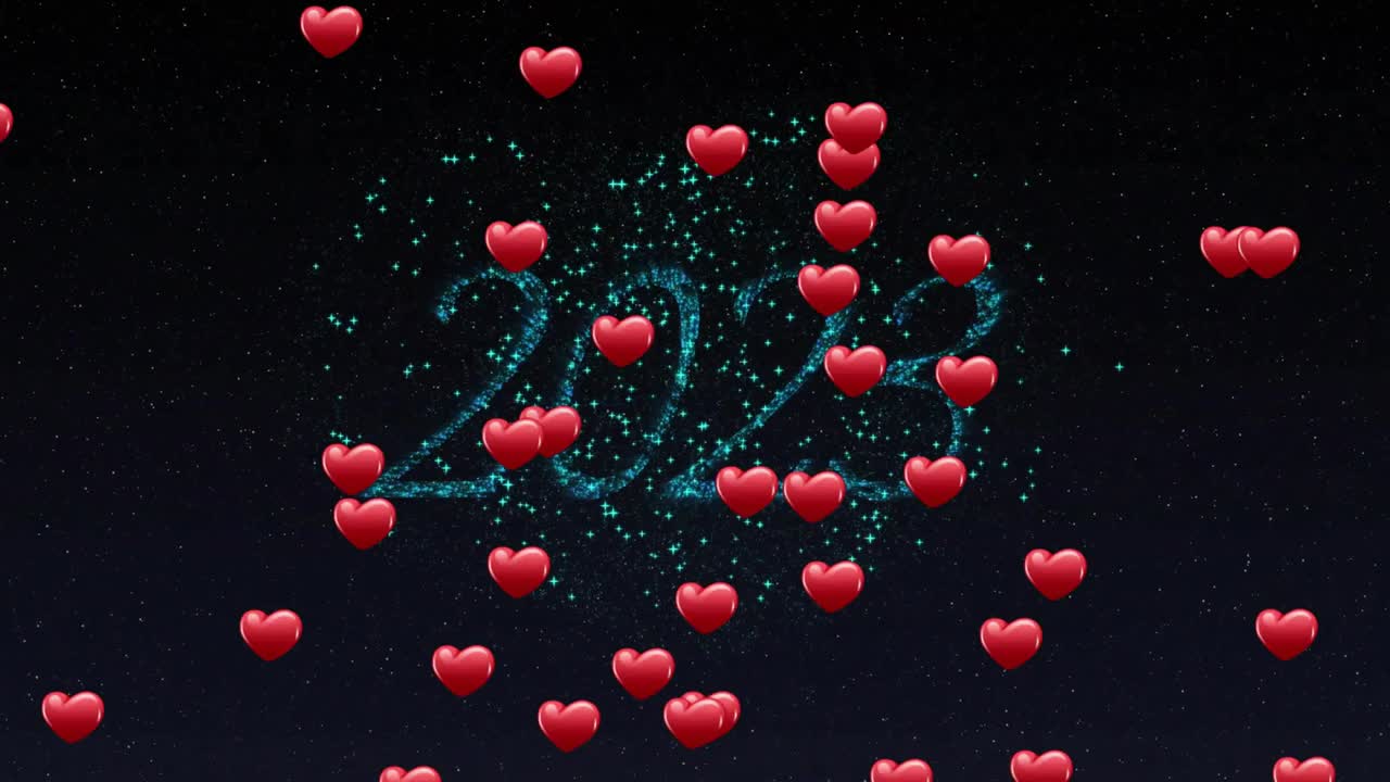 Teal-blue glitter bursts emerging against dark sky, forming 2023 and releasing hearts celebrating
