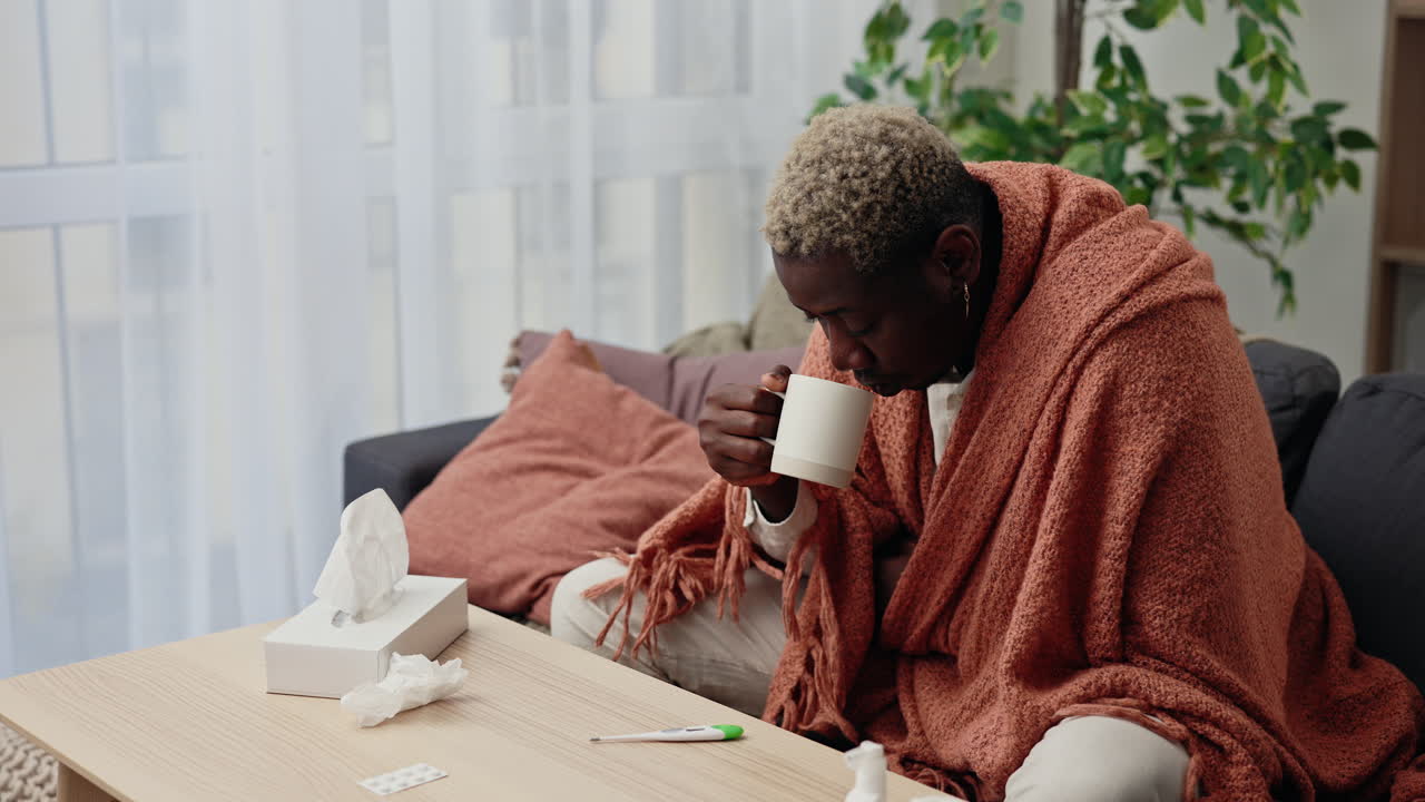 Sick Person Drinking Warm Drink