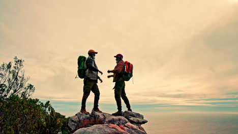 hikers celebrating on mountain top