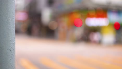 blurred city street with vibrant storefronts