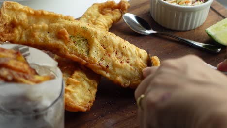 person eating fish and chips