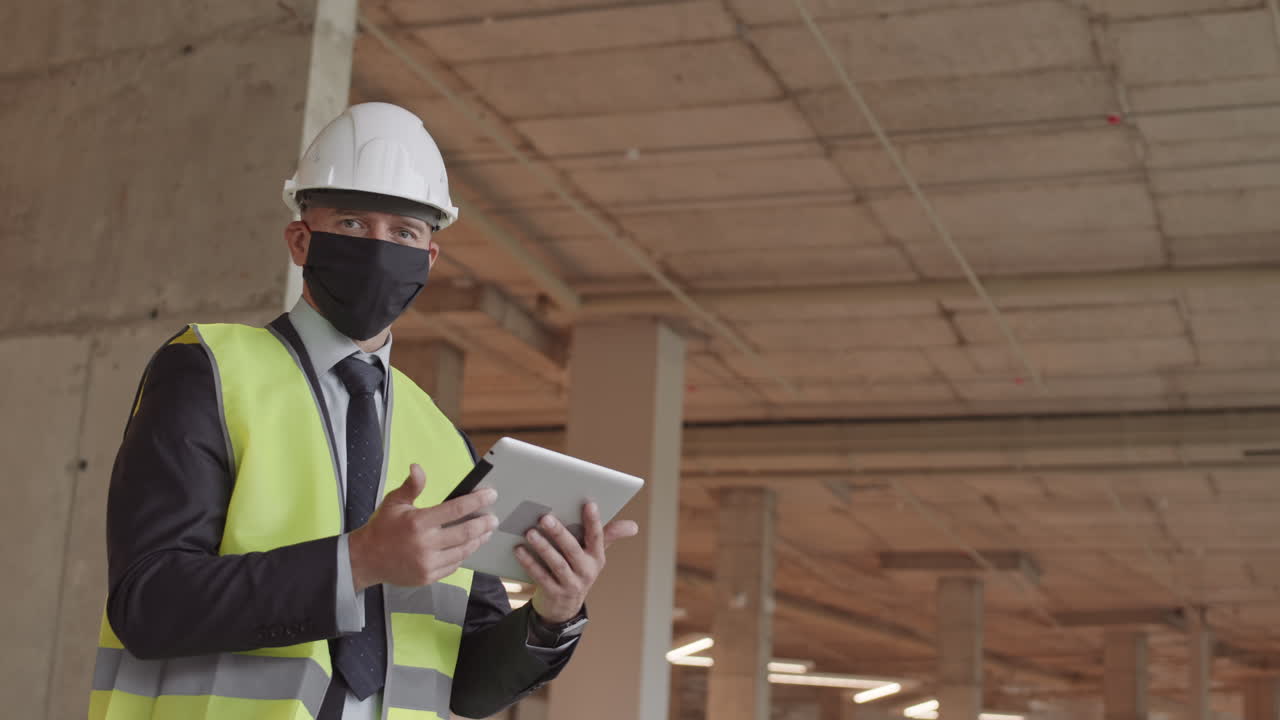 Foreman Wearing Mask Posing in Building