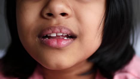 child smiling showing teeth