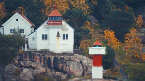 odderoya lighthouse on the rocky coast near kristiansand