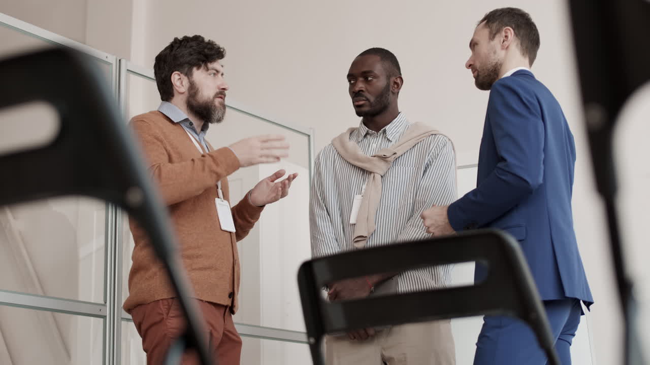 Multiethnic Men Talking in Office