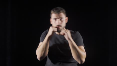 Aggressive-boxer-doing-shadow-boxing.