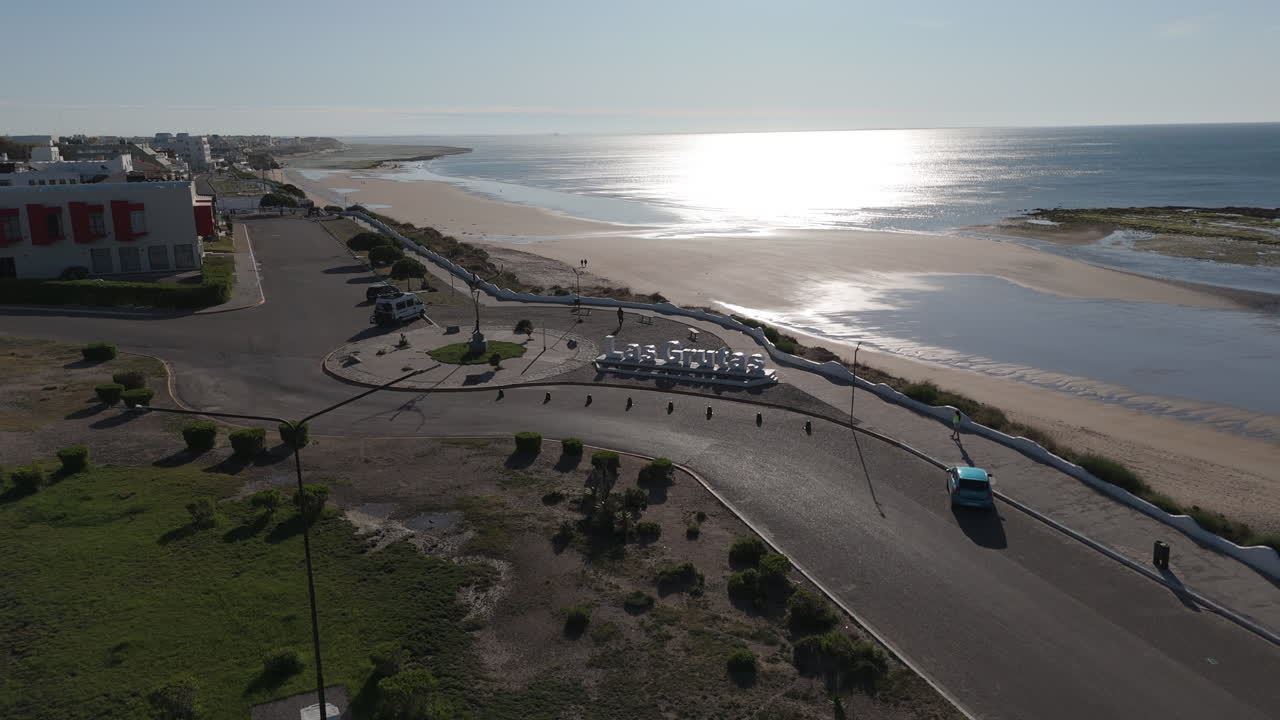 Aerial view road coasting beach city at sunrise. Las Grutas Argentina