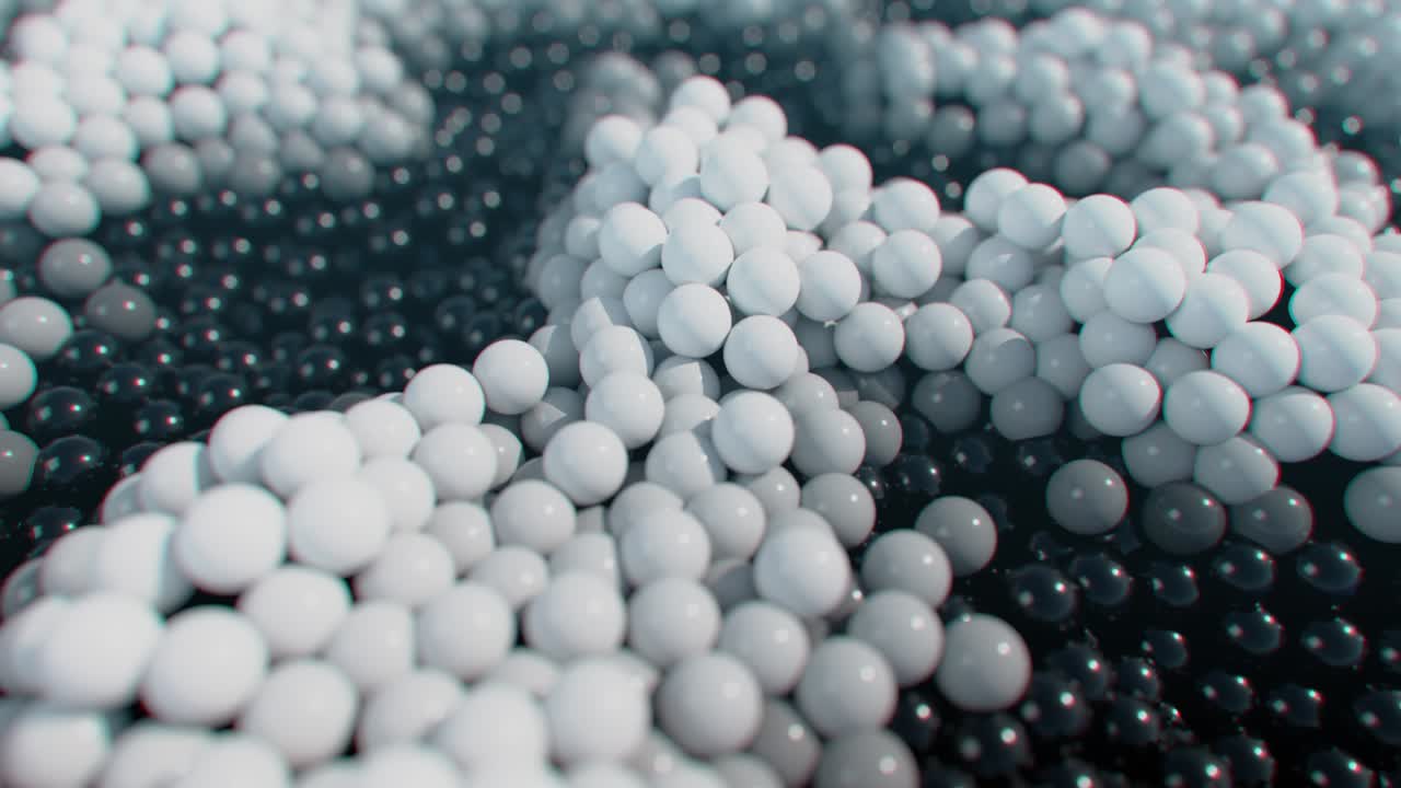 움직이는 파도 표면에 있는 동적 검은색과 색의 공.