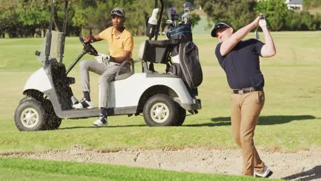 Video-of-diverse-male-friends-playing-golf-on-golf-field