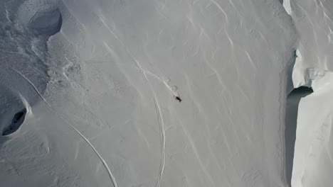 4k drone footage of extreme skier on steep slope