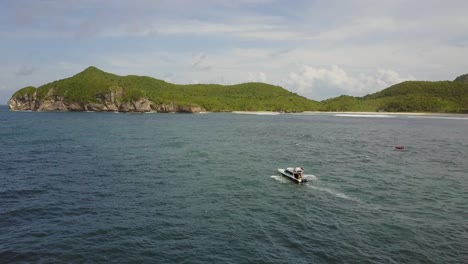 Speedboat-in-the-tropical-waters-of-West-Sumbawa,-Indonesia