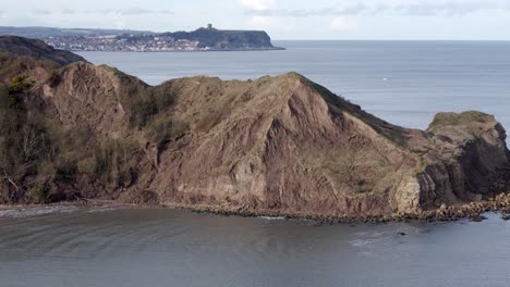 aerial footage of north yorkshire coastline with scarborough town in the distance