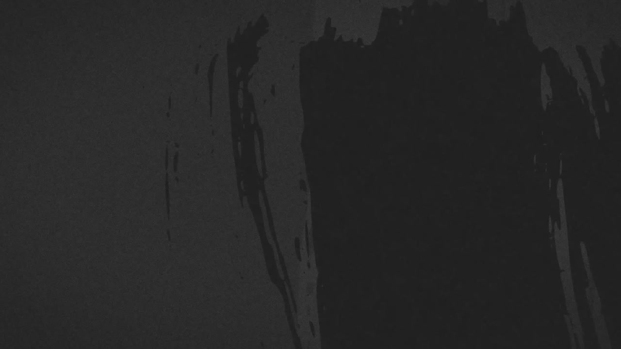animación de marcas negras y arañazos que se mueven sobre un fondo gris oscuro