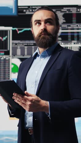 vertical video business expert reflecting on monthly performance metrics on dashboards