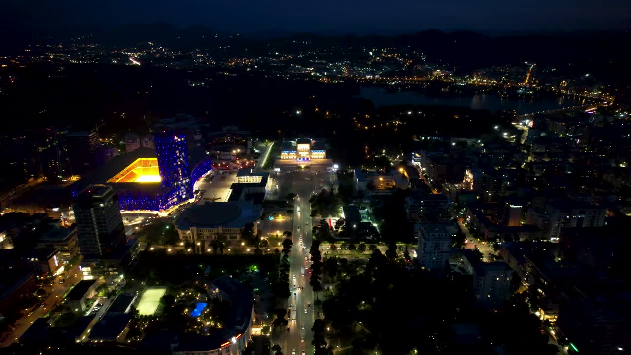 Tirana's Nocturnal Splendor: Capital City at Night, Illuminated Buildings, and Boulevard Ablaze with Vibrant Lights - Urban Elegance