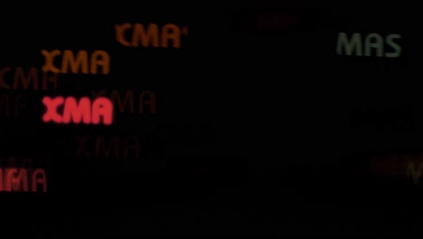 beautiful xmas text shaped bokeh from moving car and traffic lights at the evening, christmas, winter or holiday background concept, copyspace