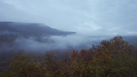 Drone-panning-over-the-Balkan-Mountains-at-the-location-of-Kozarnika-Cave,-an-archaeological-site-located-in-the-municipality-of-Dimovo-in-Bulgaria