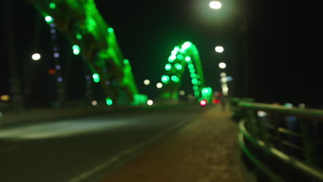 Bokeh-of-vehicles-crossing-through-Dragon-Bridge-in-Da-Nang-city-of-Vietnam-built-over-Han-river-at-night