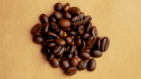 pile of coffee beans rotates in a circle close up filming from above vintage look