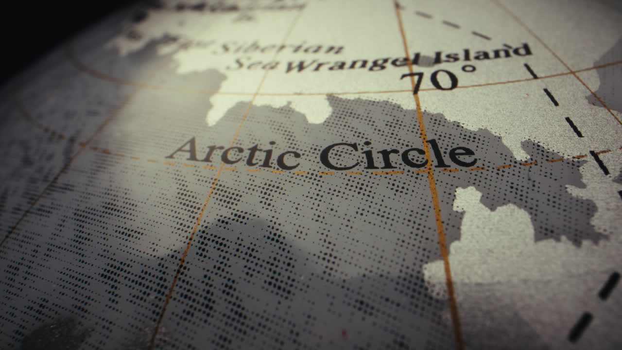 Close-up view of the Arctic Circle on a globe